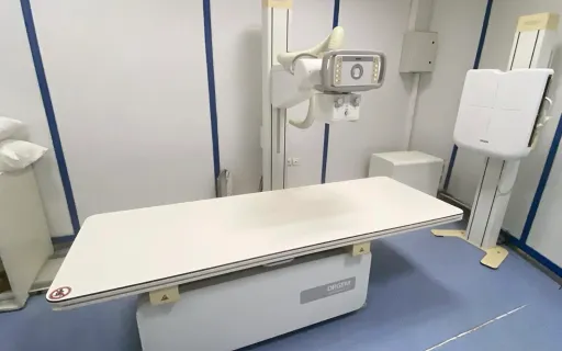 X-ray machine and examination table at the clinic.